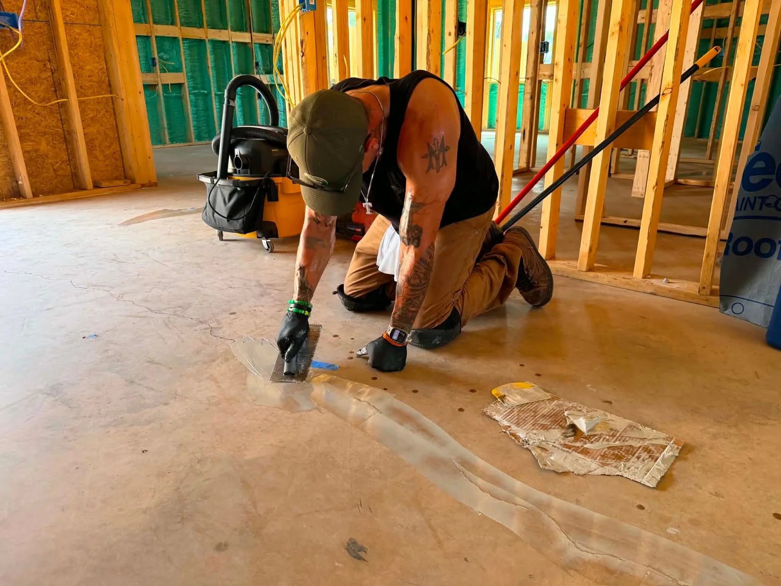Blake Mendoza addressing a crack in the concrete before the resin installation