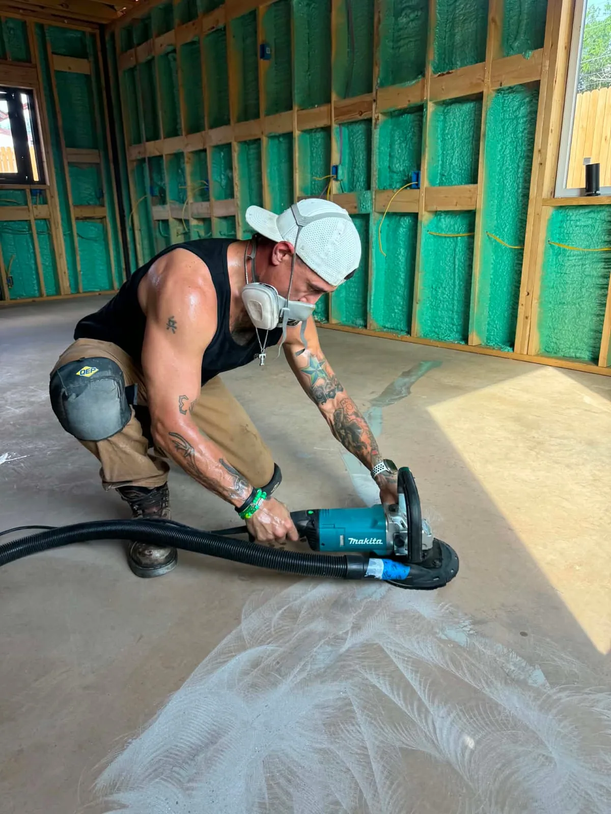 Blake Mendoza mechanically grinding the interior concrete floor in Sweetwater