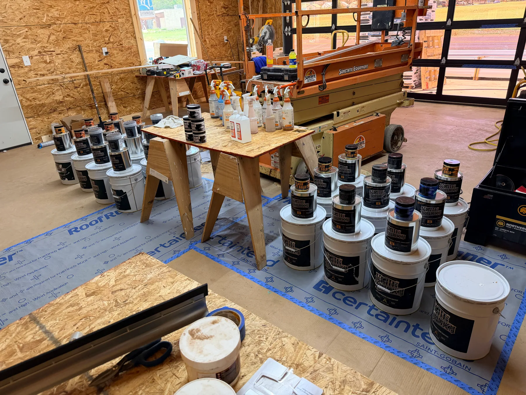 Preparing the Elite Epoxy Luxury Resin System 2:1 Part A & Part B with is respective Metallic Mica. Moisture Vapor Barrier mixed with base tint coat laid out be